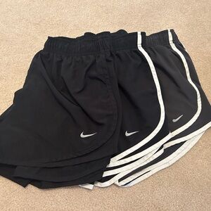 3 Nike shorts, Medium, in black, black with white trim, and grey with white trim